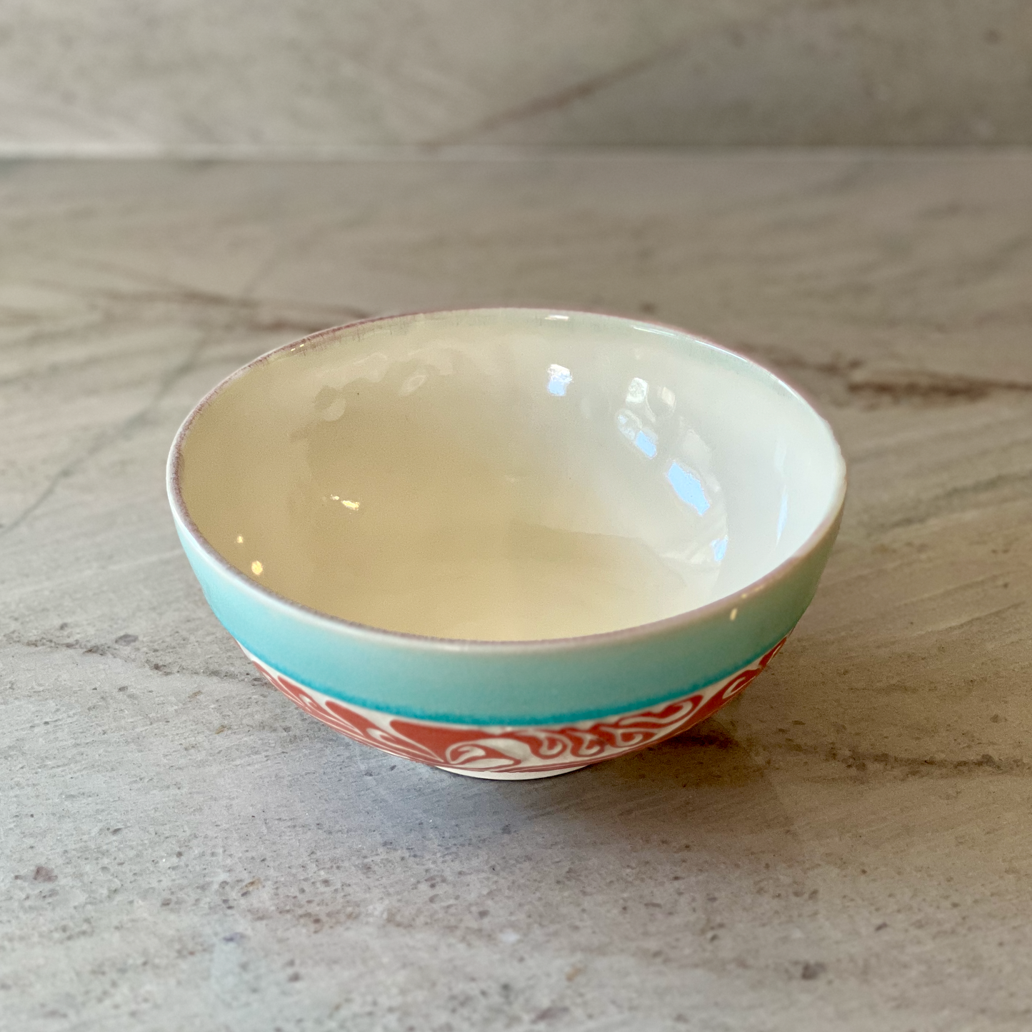 Porcelain Bowl with Octopus Colored Slip Carving