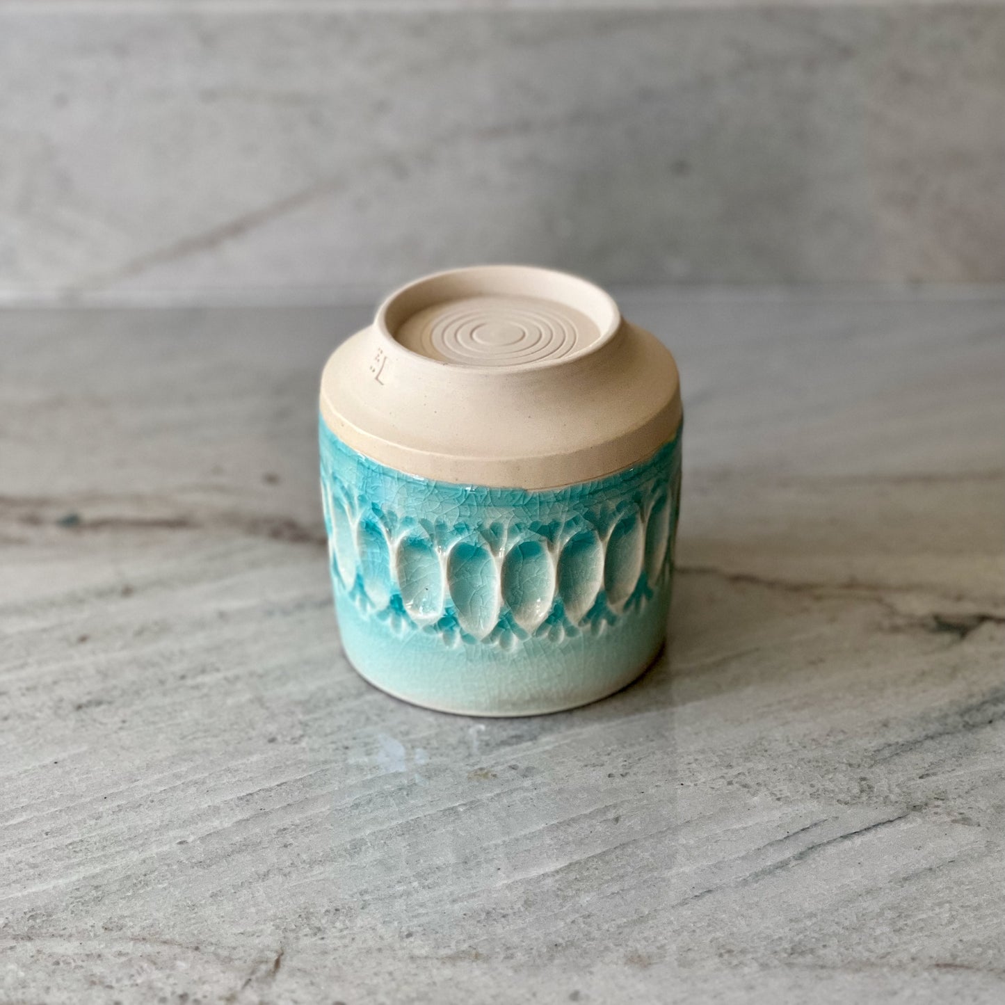 White Clay Cup With Relief Carving and Blue Glaze