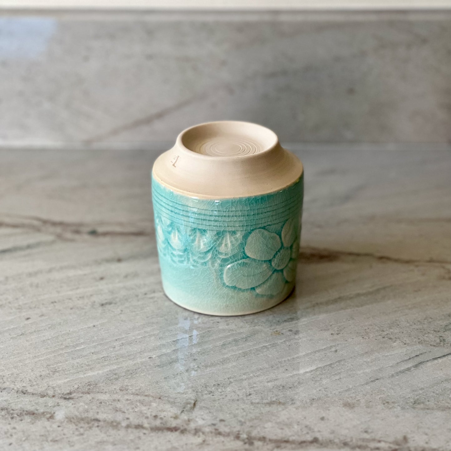 White Clay Cup With Relief Carving and Blue Glaze