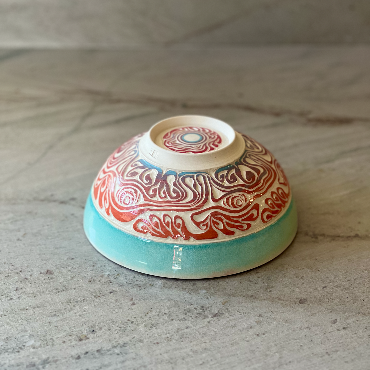 Porcelain Bowl with Octopus Colored Slip Carving