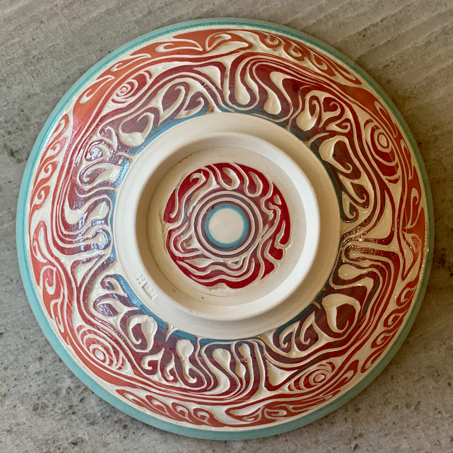 Porcelain Bowl with Octopus Colored Slip Carving