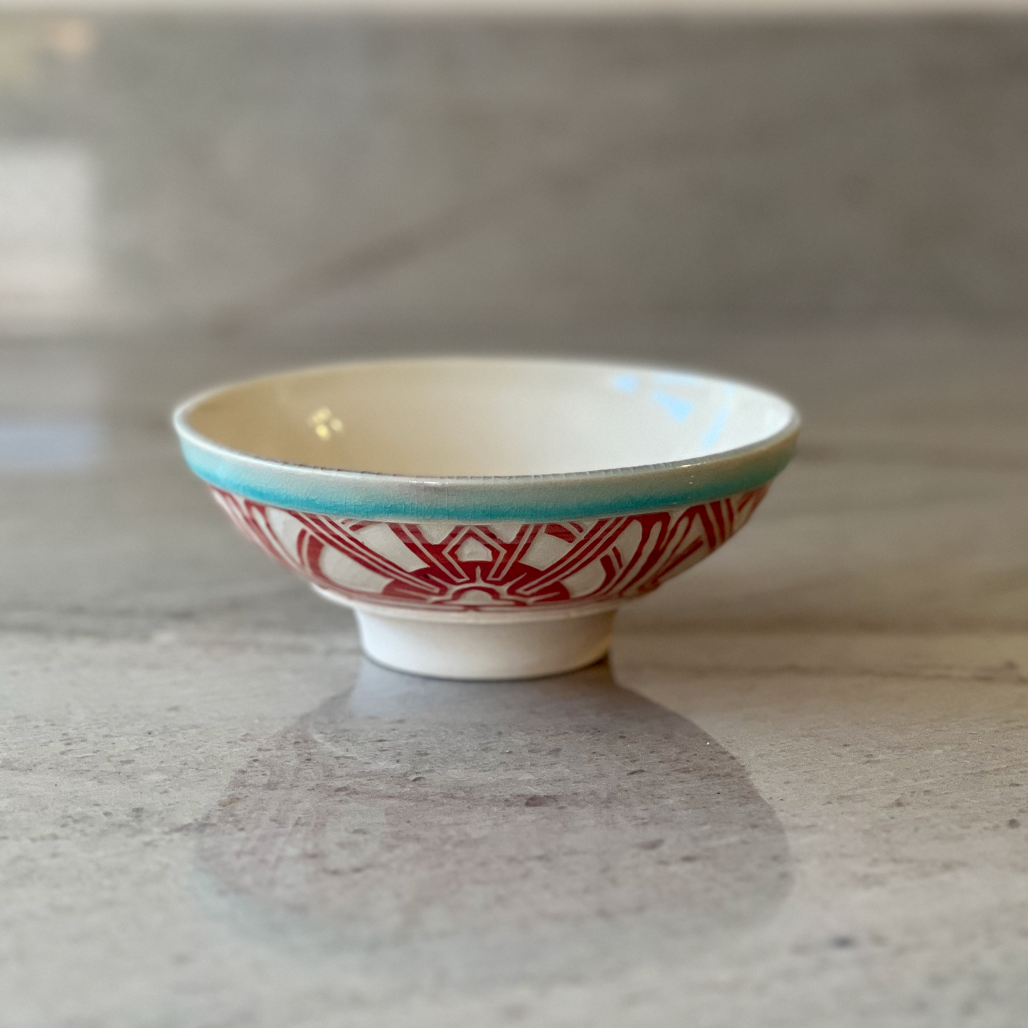 Porcelain Bowl with Geometric Red Slip Carving