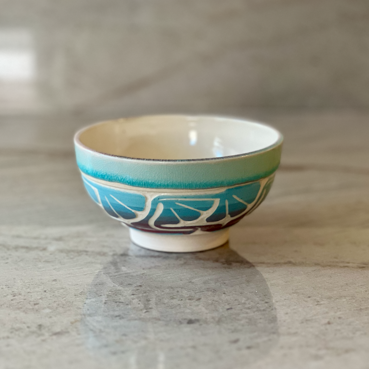 Porcelain Bowl with Floral Red and Blue Slip Carving
