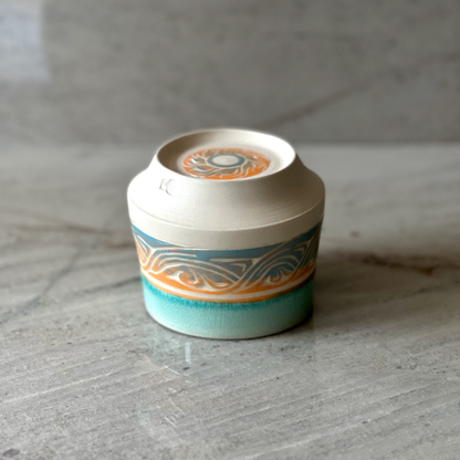 Small Porcelain Cup, Blue and Orange Slip with Blue Glaze