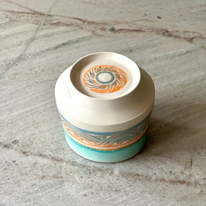 Small Porcelain Cup, Blue and Orange Slip with Blue Glaze