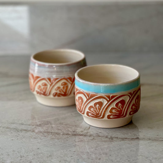 Pair of White Clay Cups, Terracotta Carving, and Blue Glaze