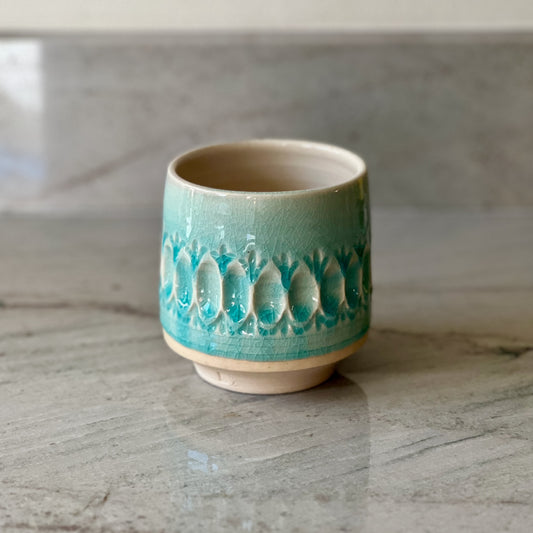 White Clay Cup With Relief Carving and Blue Glaze