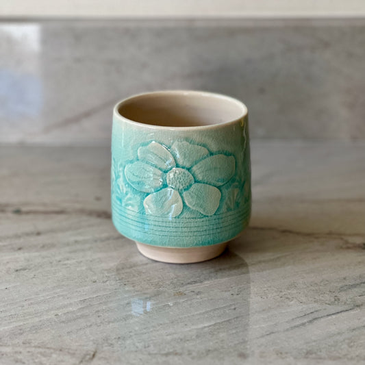 White Clay Cup With Relief Carving and Blue Glaze