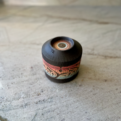 Charcoal Cup with Blue, Orange, and Red Carving