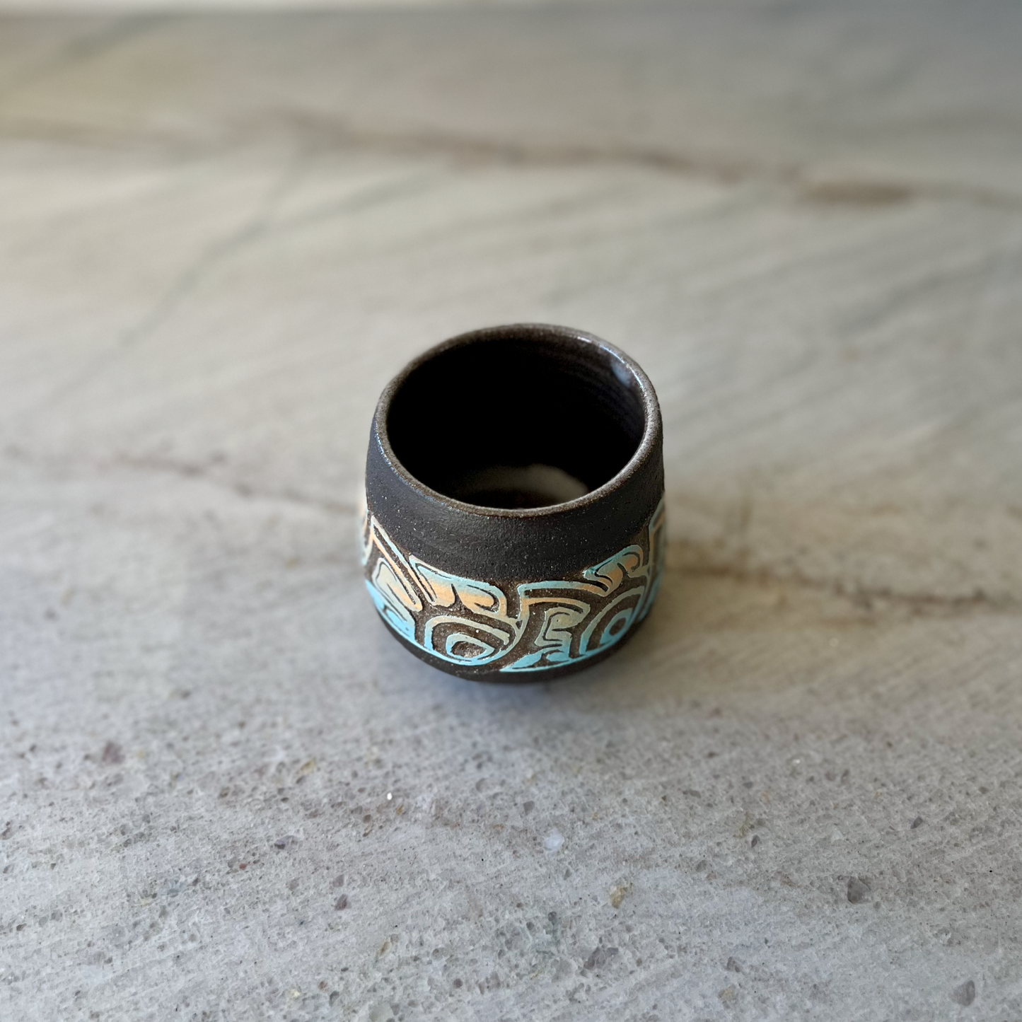 Charcoal Cup with Blue and Orange Carving