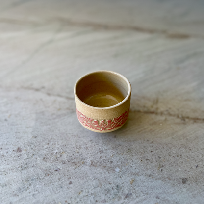 Sandy Clay Teacup with Red Carving 1