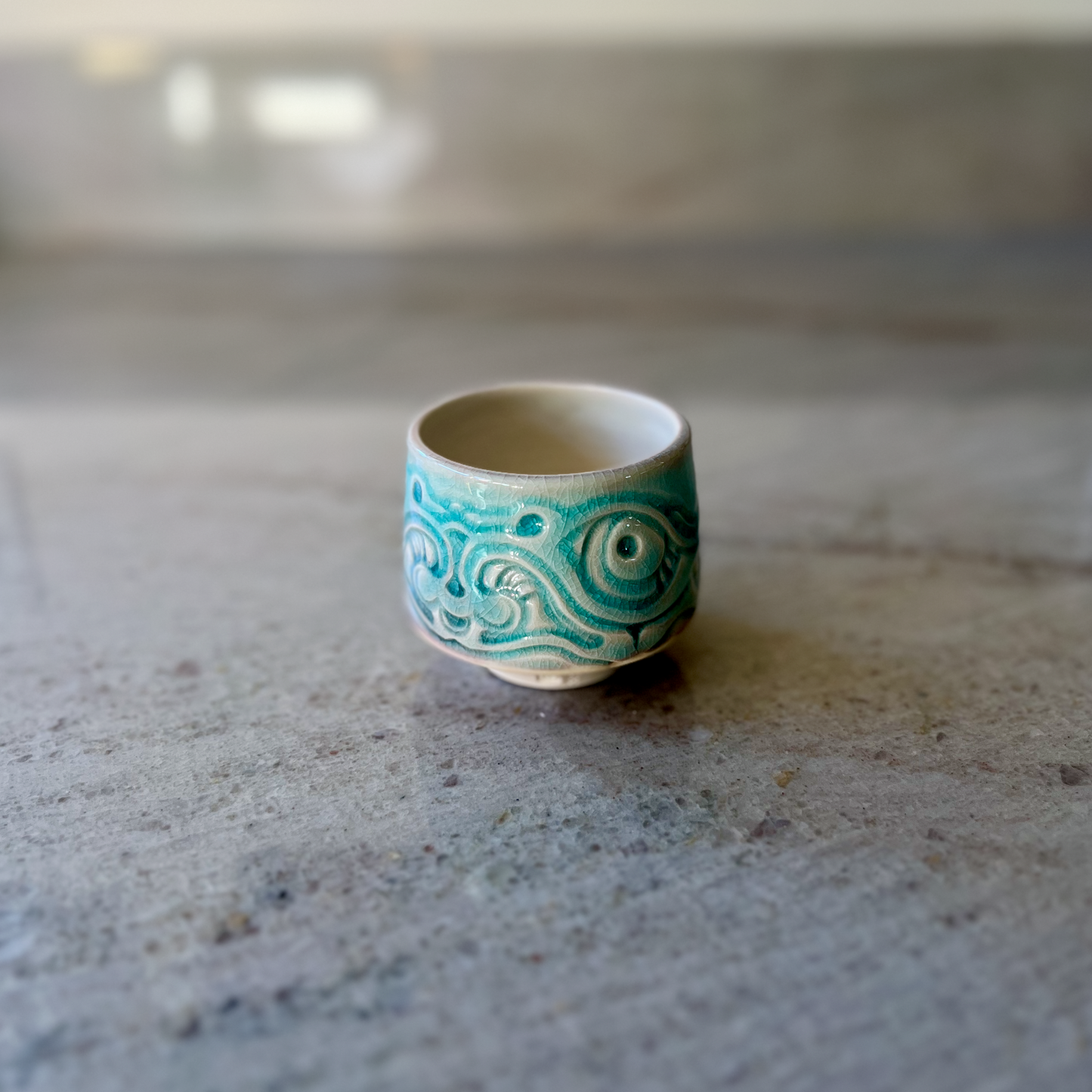 Porcelain Teacup with Blue Fish Relief Carving
